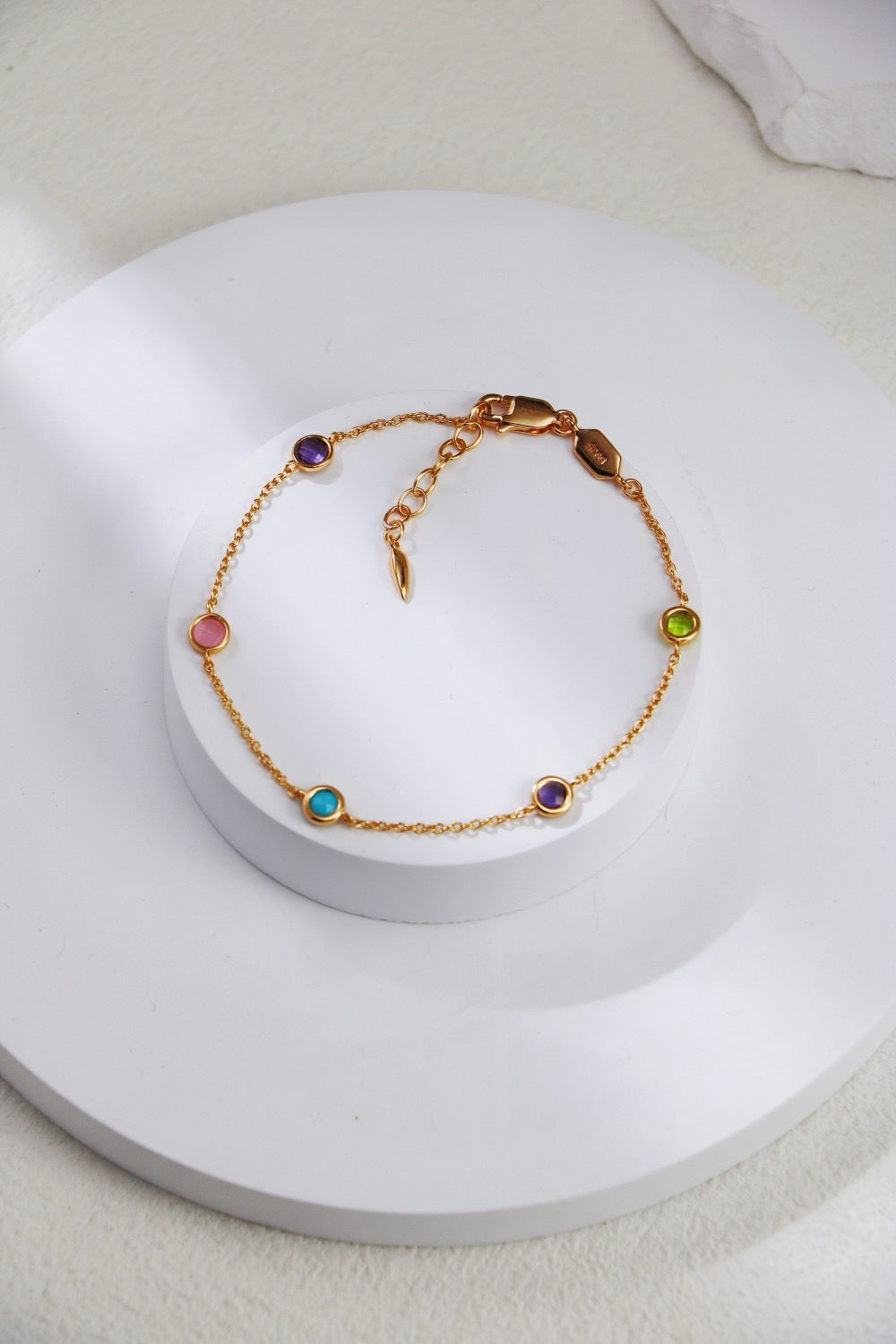 Sterling silver bracelet with diamond cut edge color gemstone