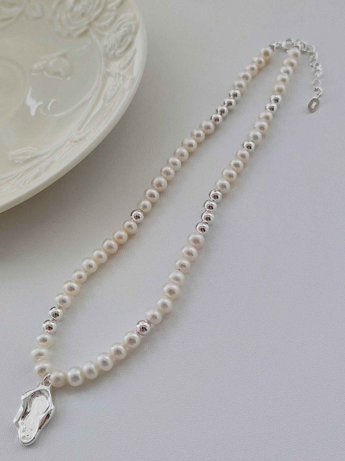 Adjustable pearl necklace with zen lakeside silver pendant