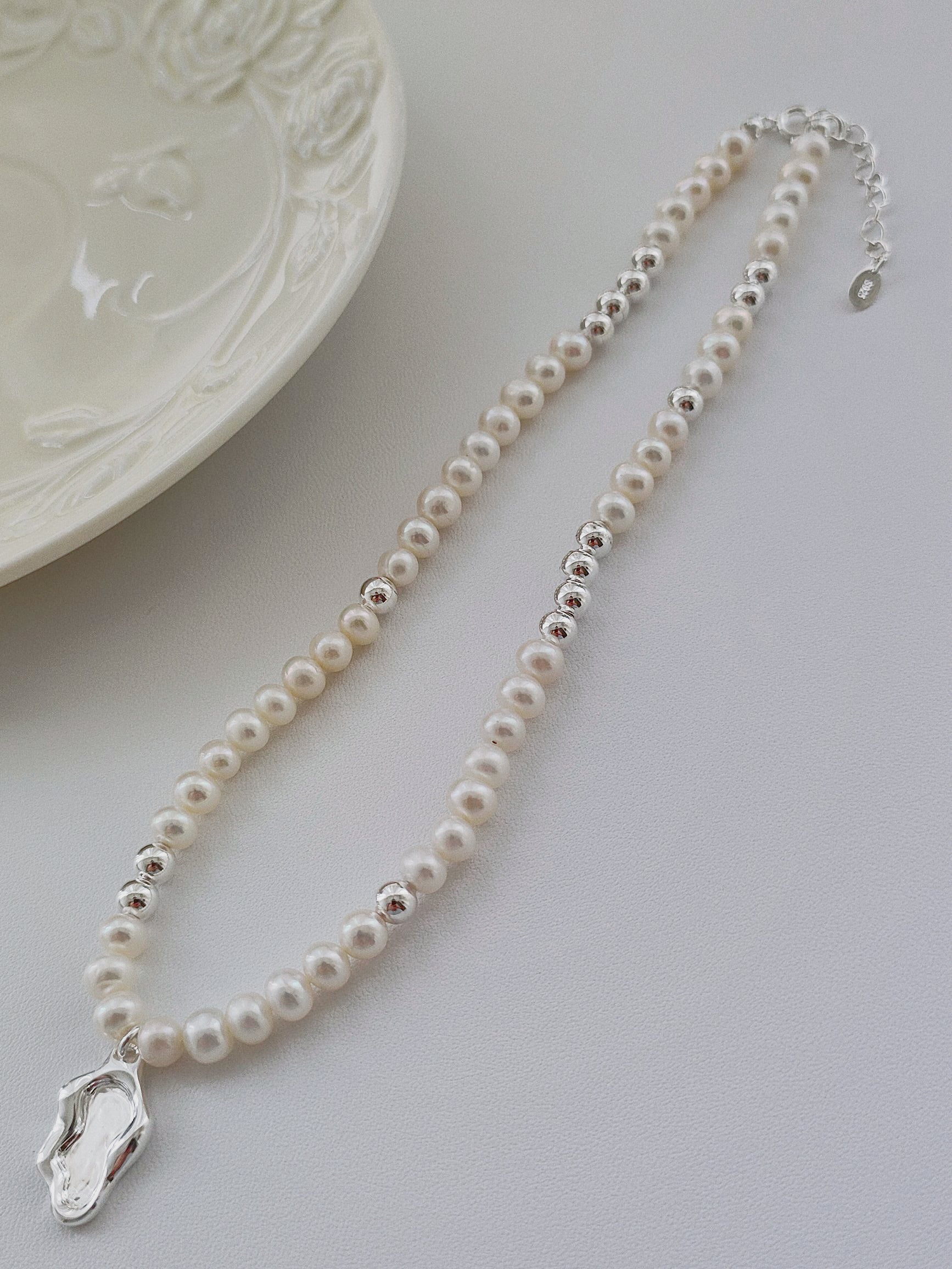 Adjustable pearl necklace with zen lakeside silver pendant