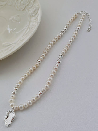 Adjustable pearl necklace with zen lakeside silver pendant
