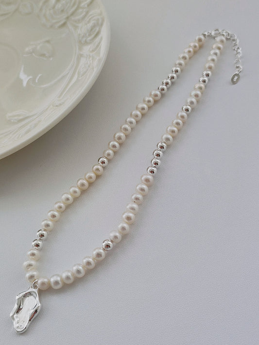 Adjustable pearl necklace with zen lakeside silver pendant