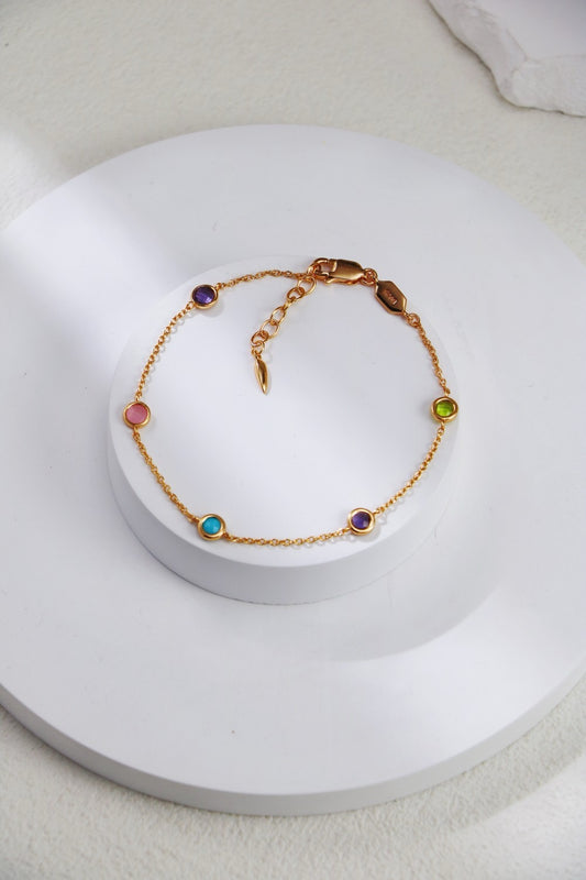 Sterling silver bracelet with diamond cut edge color gemstone